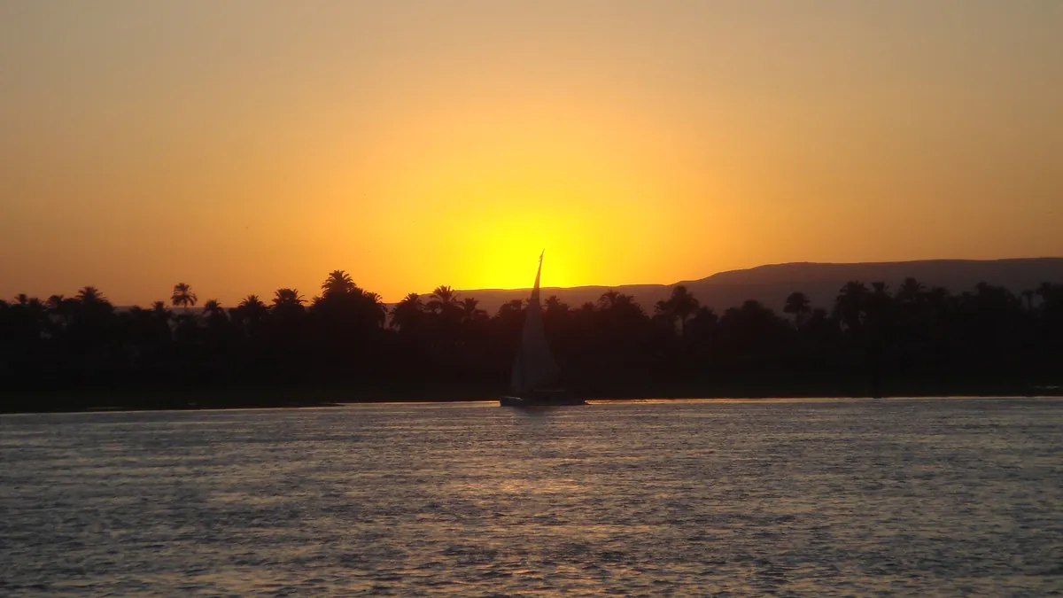 Felucca sailing the Nile at sunset in Egypt