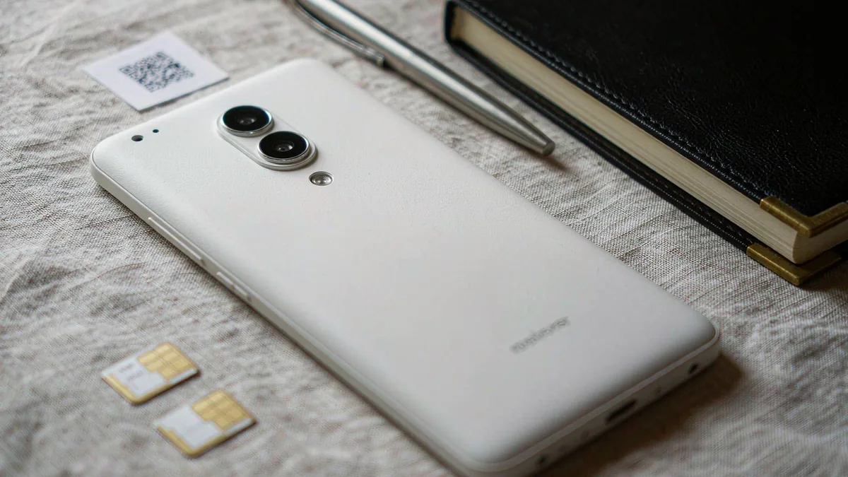 Galaxy S26 Ultra flat-lay with two nano-SIM cards and an eSIM QR code