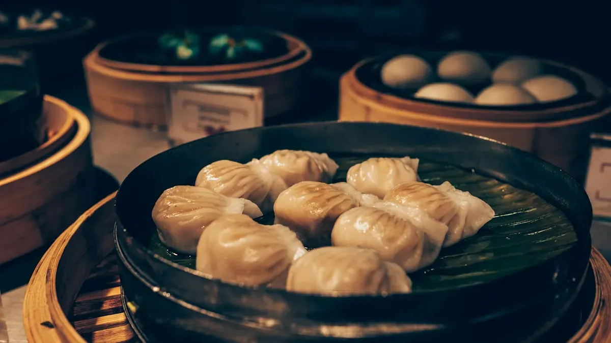 Bamboo baskets of dim sum on a restaurant table
