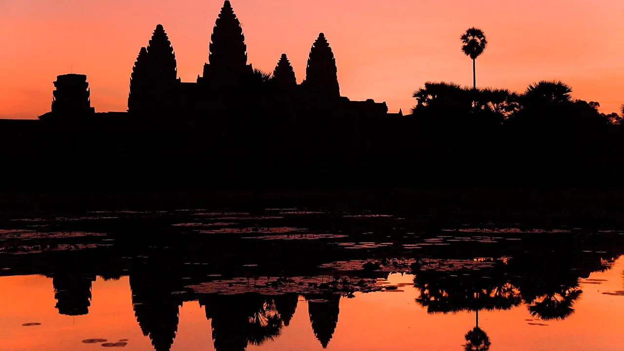 Angkor Wat silhouette and reflection at sunrise