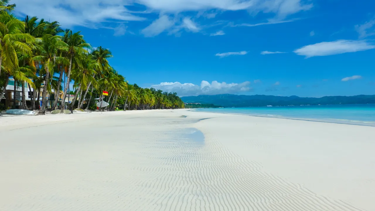 White Beach on Boracay with white sand and palm trees