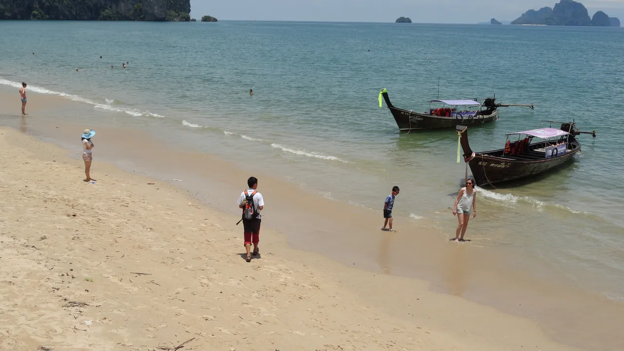 Ao Nang beach in Krabi with longtail boats and limestone karsts