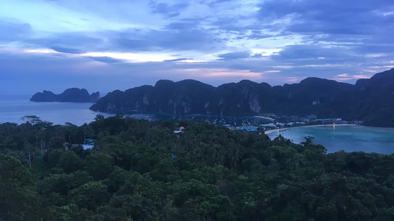 View over Ko Phi Phi Don and its curved beach at sunset